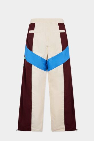 Loose broek van een trainingspak met kleurblokken